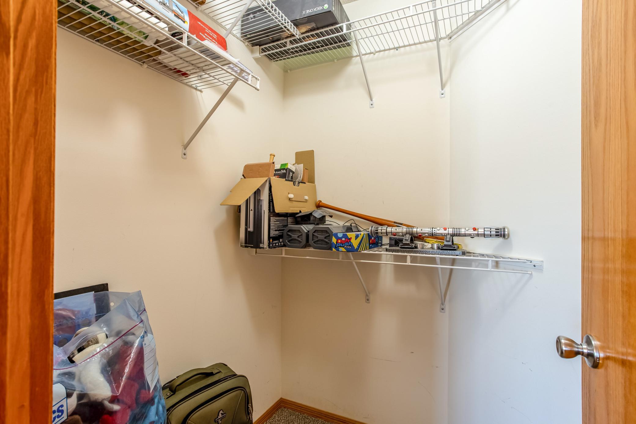 Second primary walk-in closet provides additional shelving and storage for excellent organization.