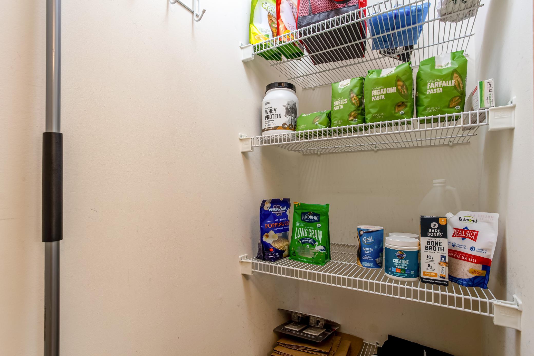 Convenient walk-in kitchen pantry provides excellent shelving and additional storage for everyday essentials.