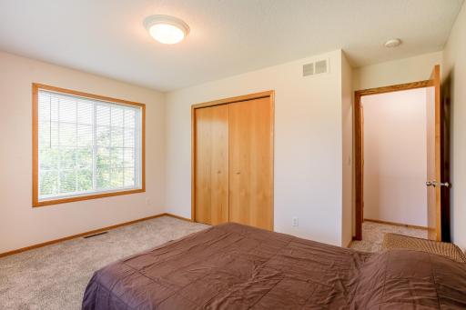 Bright and comfortable bedroom with brand-new carpet, a large window, and generous closet space.