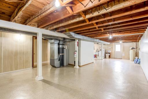 Expansive lower level provides multiple functional areas with convenient exterior access, plenty of usable space, and an opportunity to add equity.