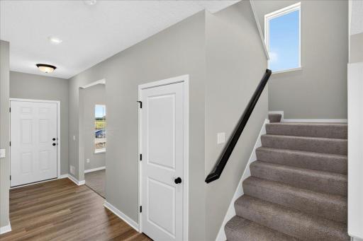 PHOTO OF A DIFFERENT HOME WITH SIMILAR PLAN & FINISHES.