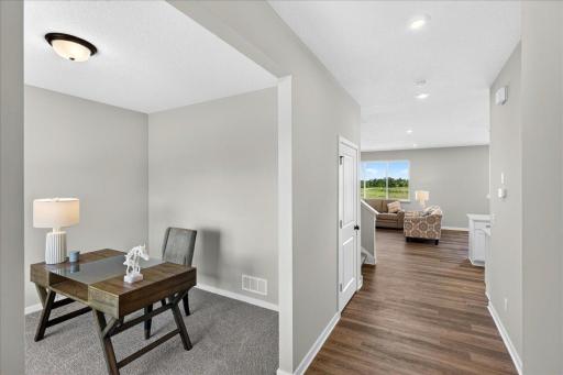 PHOTO OF A DIFFERENT HOME WITH SIMILAR PLAN & FINISHES. Foyer view to the flex and great rooms.