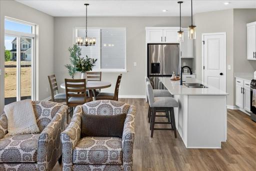 PHOTO OF A DIFFERENT HOME WITH SIMILAR PLAN & FINISHES.