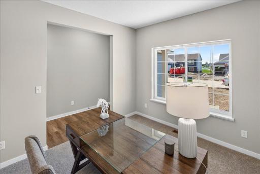 PHOTO OF A DIFFERENT HOME WITH SIMILAR PLAN & FINISHES. Flex Room.
