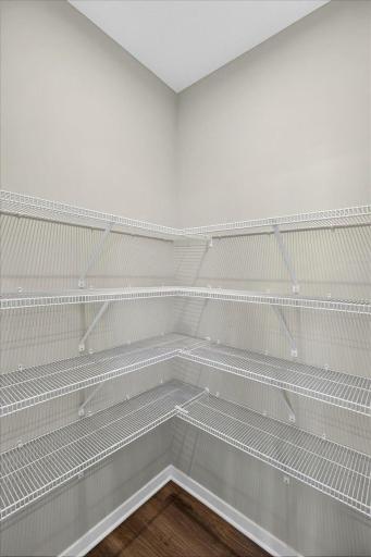 PHOTO OF A DIFFERENT HOME WITH SIMILAR PLAN & FINISHES. Kitchen Walk-in Pantry.