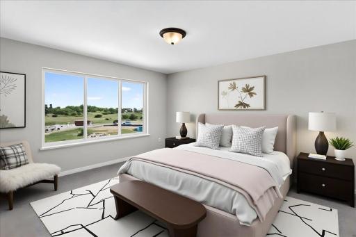 PHOTO OF A DIFFERENT HOME WITH SIMILAR PLAN & FINISHES VIRTUALLY STAGED. Primary Suite offers backyard views.