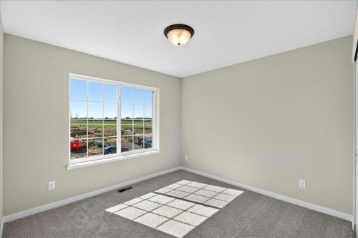 PHOTO OF A DIFFERENT HOME WITH SIMILAR PLAN & FINISHES. Bedroom 3.