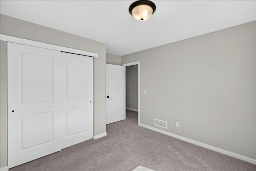 PHOTO OF A DIFFERENT HOME WITH SIMILAR PLAN & FINISHES. Bedroom 3.