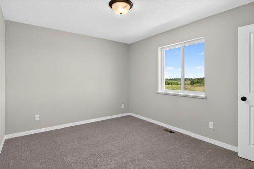 PHOTO OF A DIFFERENT HOME WITH SIMILAR PLAN & FINISHES. Bedroom 4.