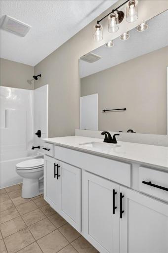 PHOTO OF A DIFFERENT HOME WITH SIMILAR PLAN & FINISHES. Upper Floor Main Full Bathroom.