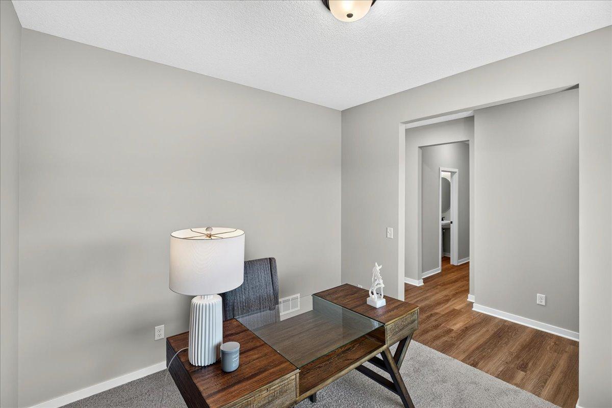 PHOTO OF A DIFFERENT HOME WITH SIMILAR PLAN & FINISHES. Flex Room.