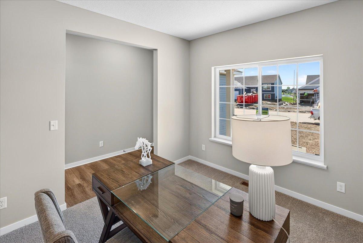 PHOTO OF A DIFFERENT HOME WITH SIMILAR PLAN & FINISHES. Flex Room.