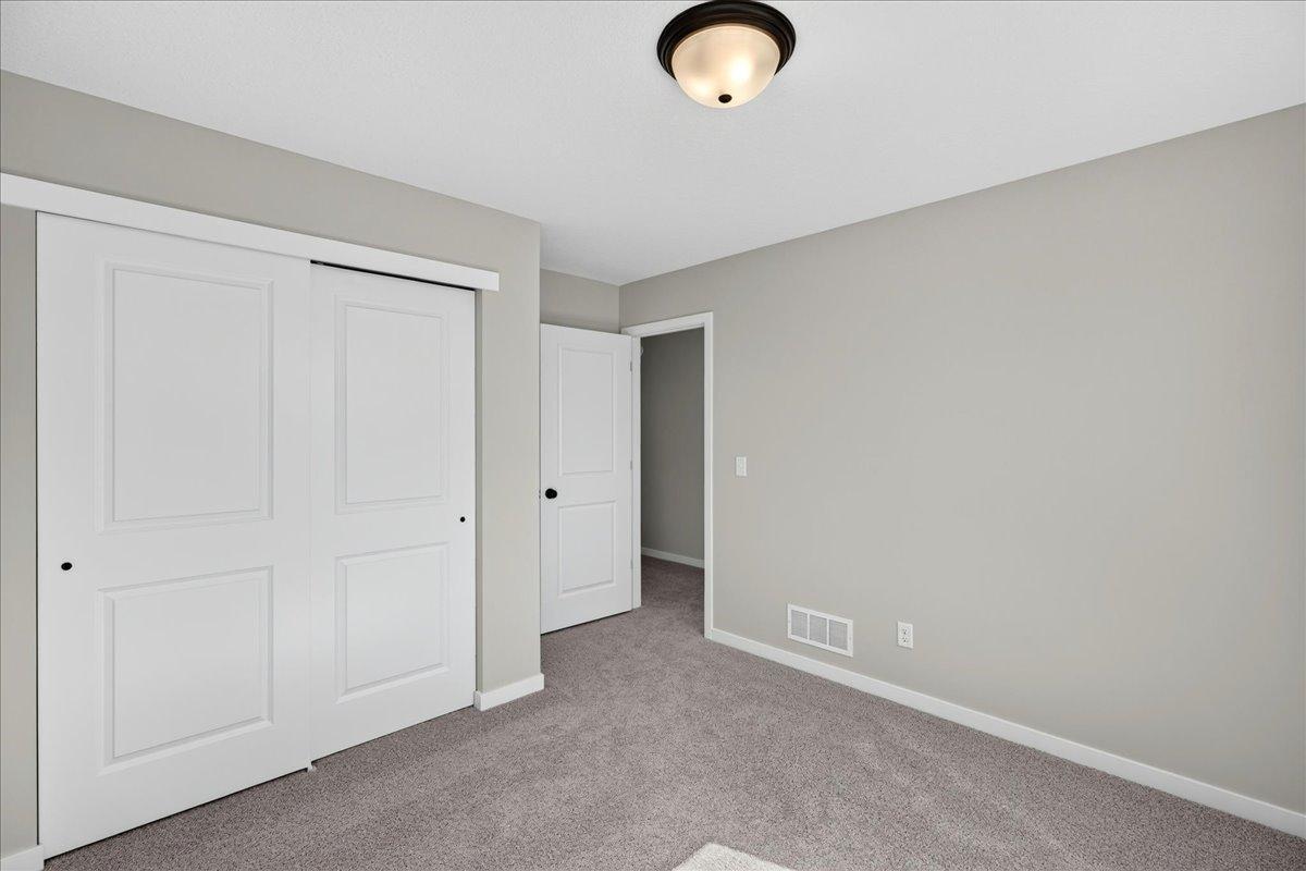 PHOTO OF A DIFFERENT HOME WITH SIMILAR PLAN & FINISHES. Bedroom 3.