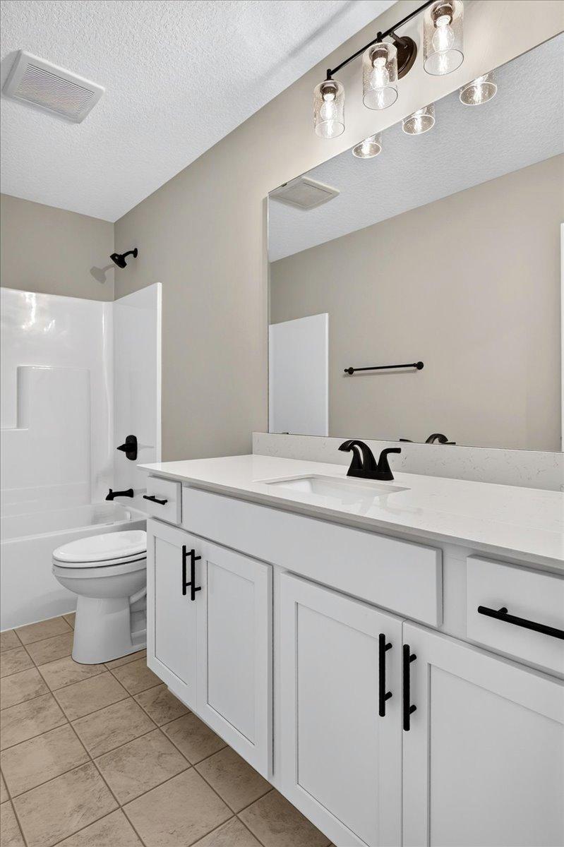 PHOTO OF A DIFFERENT HOME WITH SIMILAR PLAN & FINISHES. Upper Floor Main Full Bathroom.