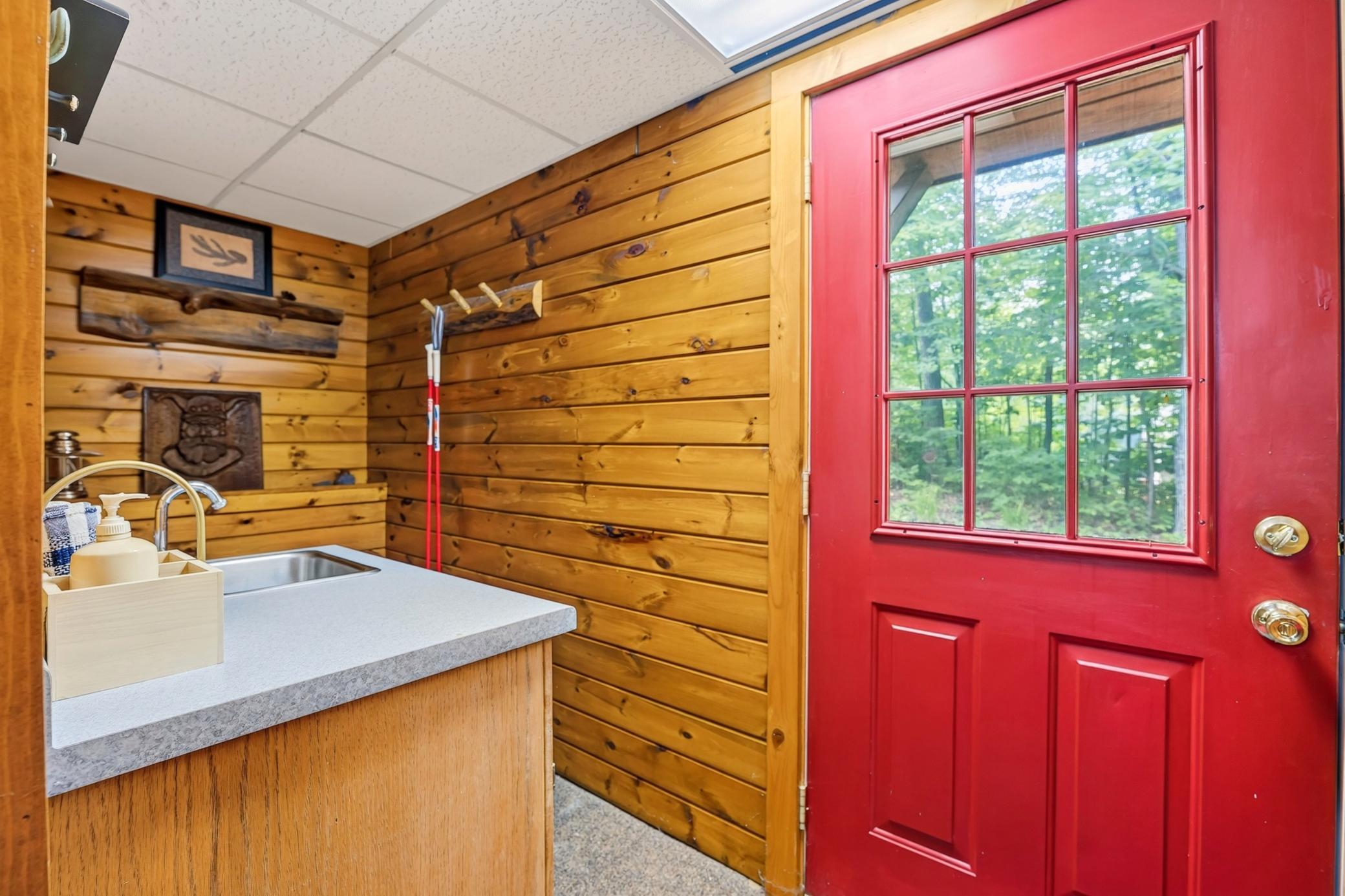Lower-level mudroom with a convenient side entrance door.