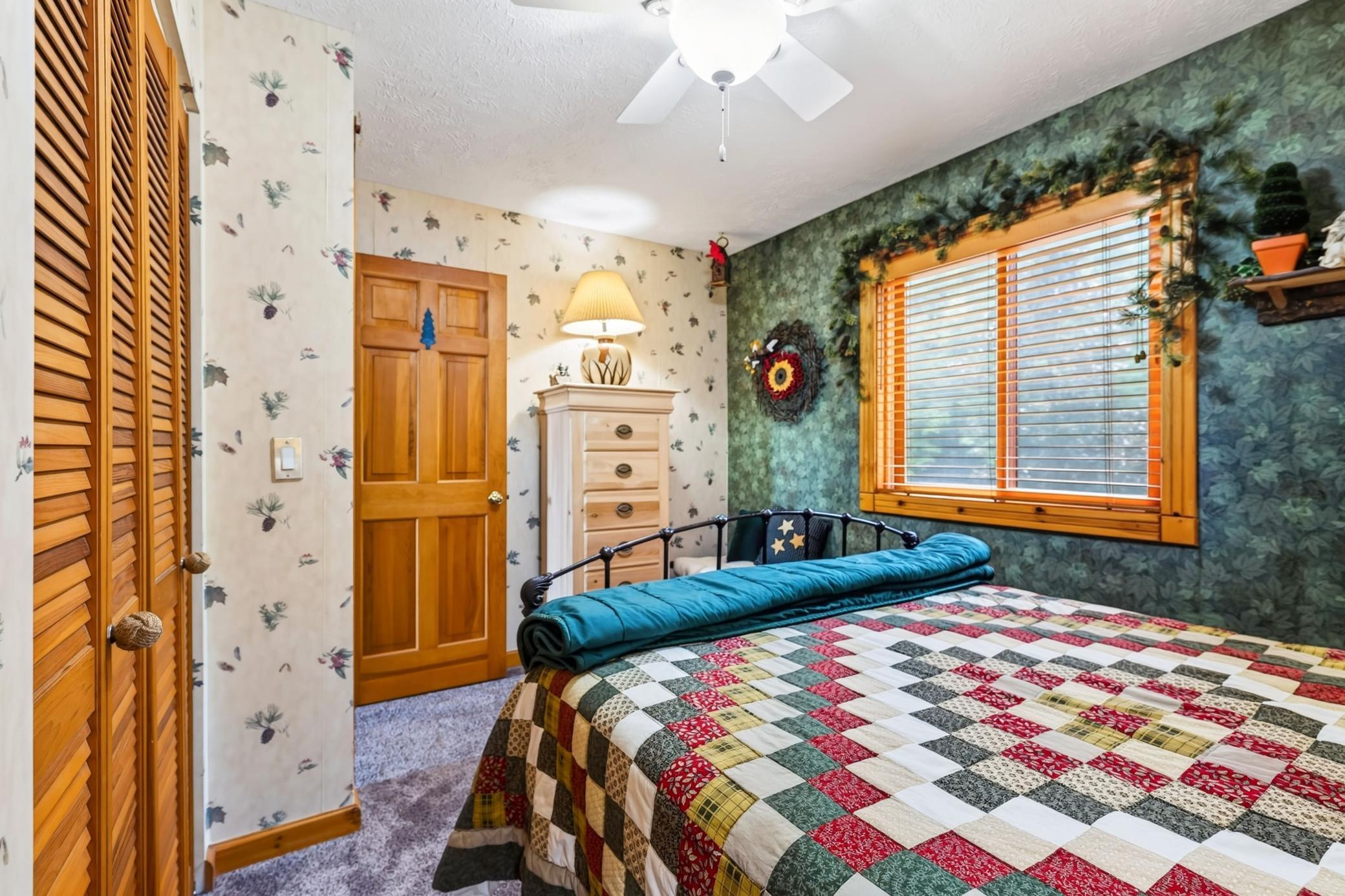 Second guest bedroom with ceiling fan.