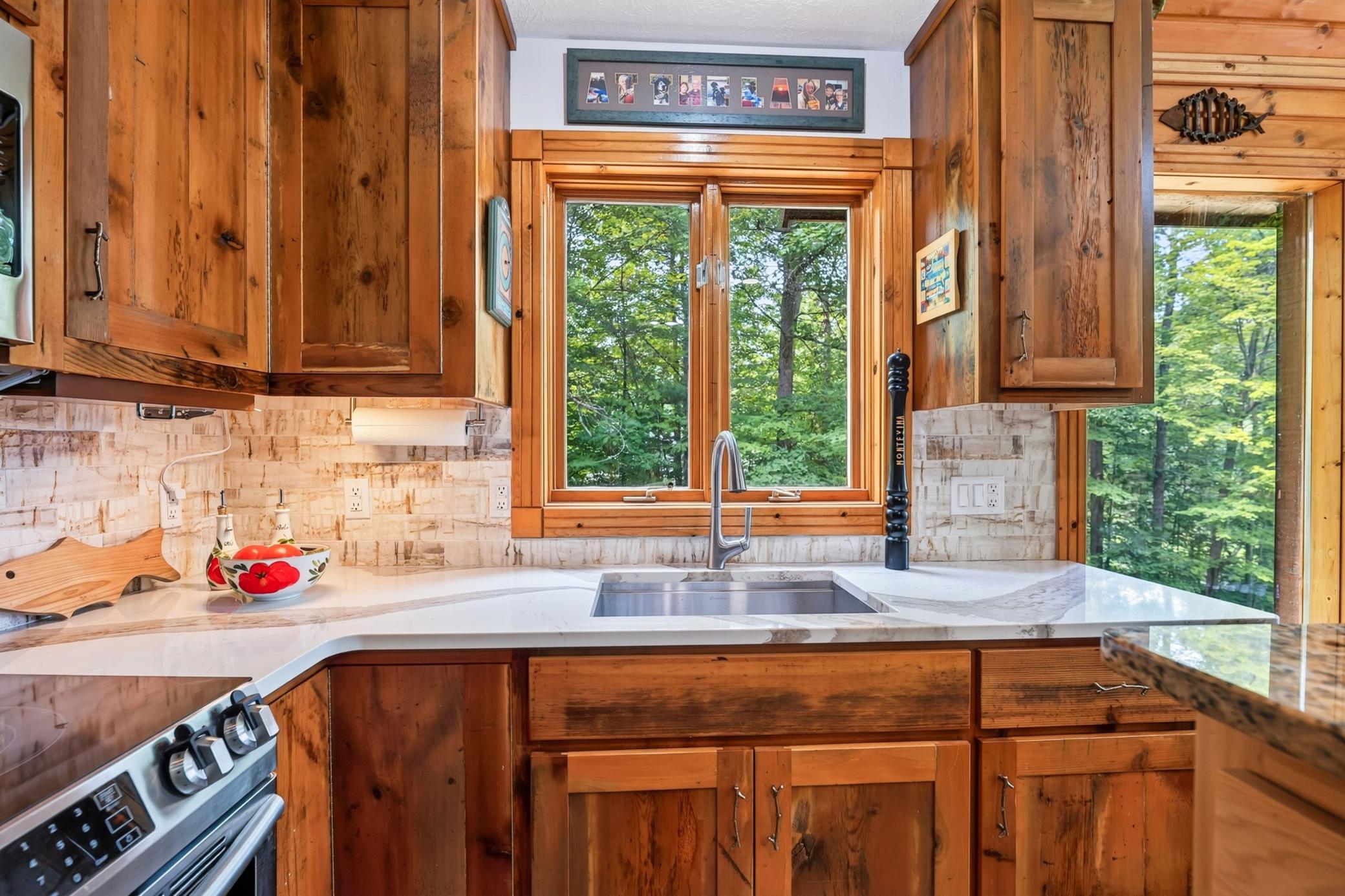 Window above the large stainless steel sink.