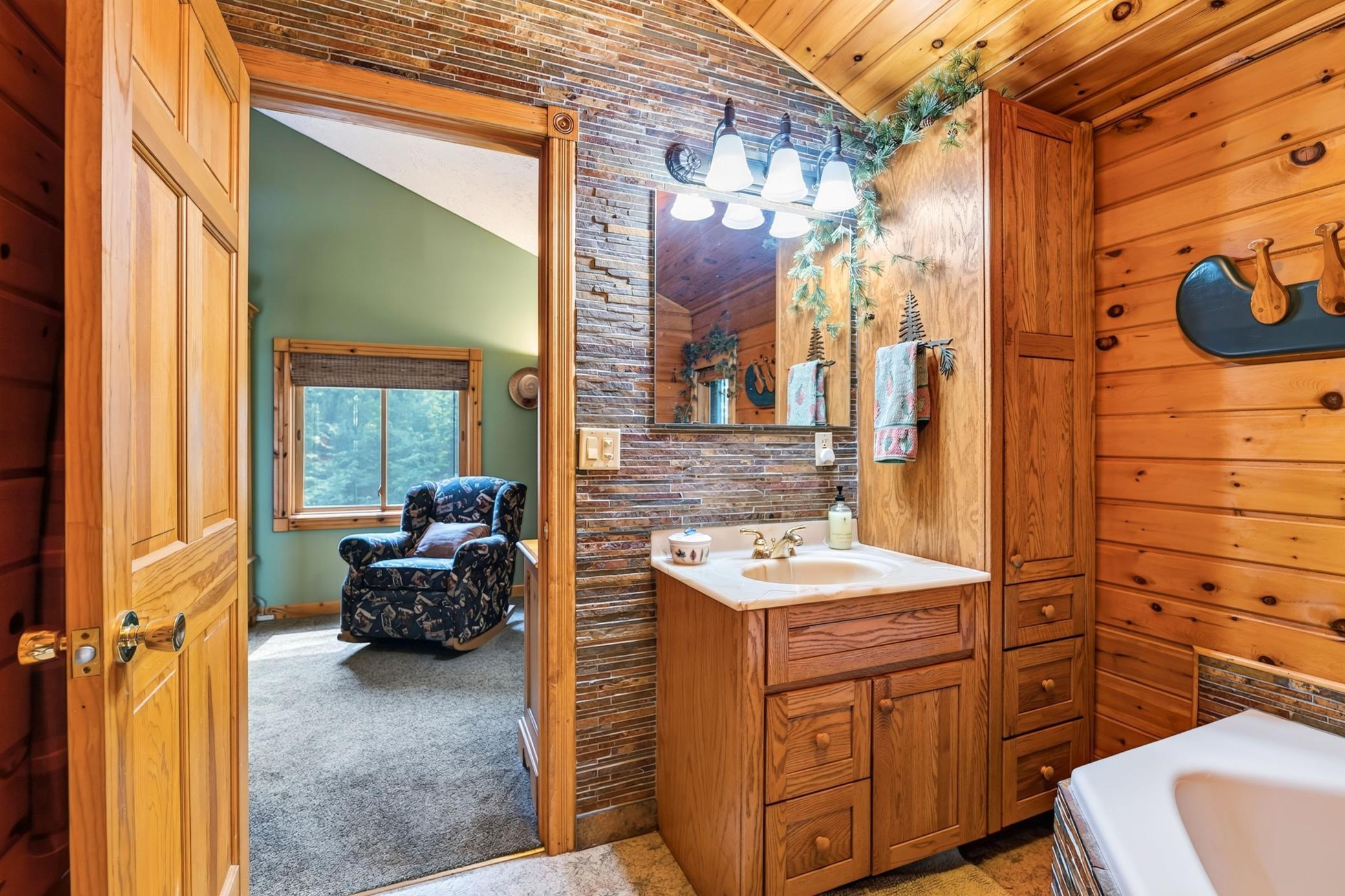Vanity sink & linen cabinet.