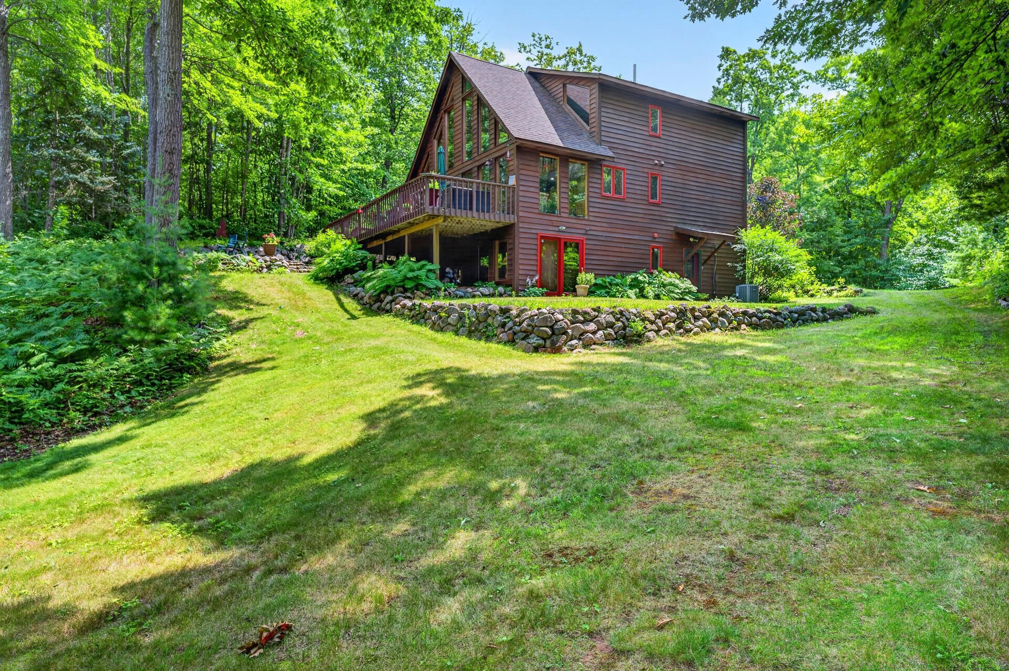 Side view with rock retaining wall.