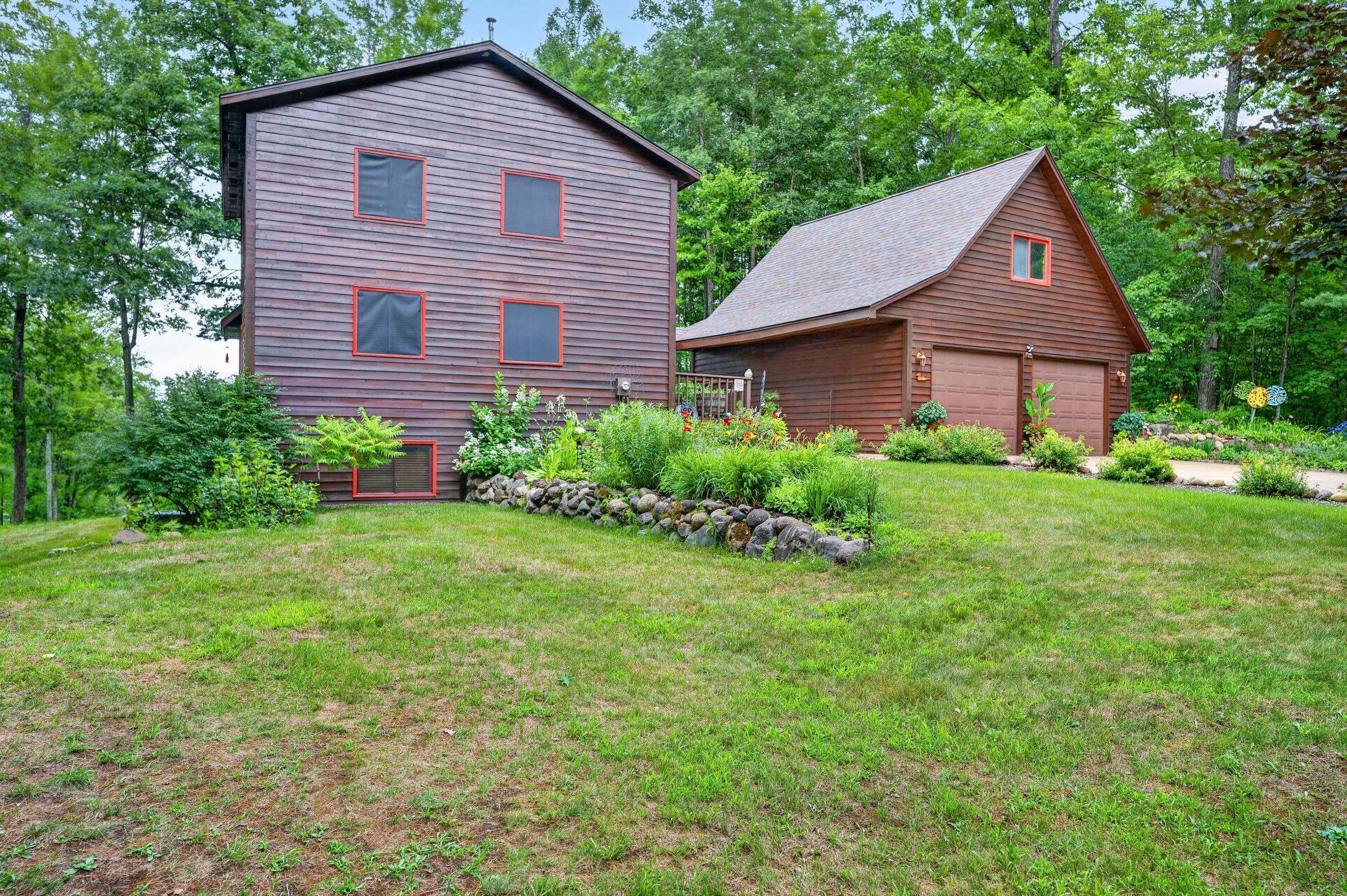 Roadside view of lake home and garage.