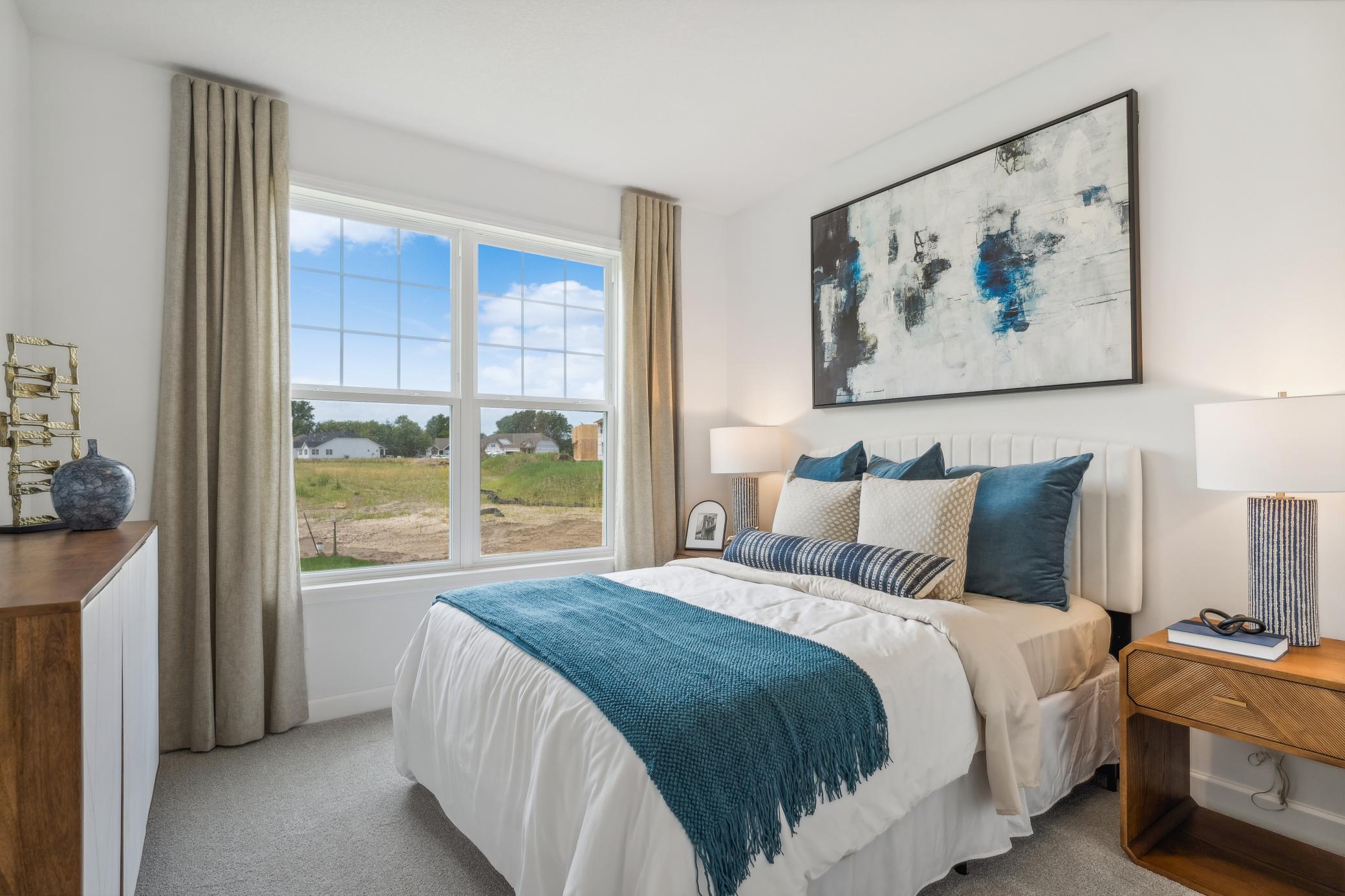 (Photo of model home, finishes will vary) Located on the first floor, this bedroom can accommodate overnight guests or visiting family members. It is adjacent to a bathroom for easy convenience.