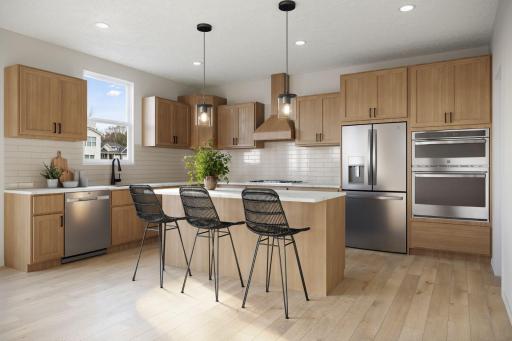 Kitchen - virtually staged. Finishes in actual home are different. Picture used for floorplan purposes.