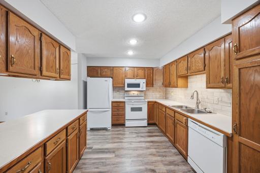 Tile backsplash, newer faucet and garbage disposal.