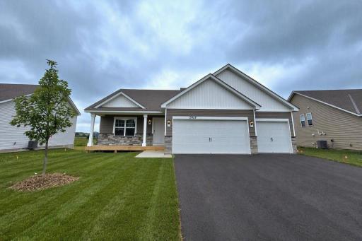 The Cameron II Heartland Cottage at Highlands at Eagle View in Elko New Market! Photo is of actual home. Options and colors may vary. Ask Sales Agent for details. AI-generated landscaping for visualization. Actual yard condition may differ.