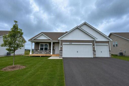 The Cameron II Heartland Cottage at Highlands at Eagle View in Elko New Market! Photo is of actual home. Options and colors may vary. Ask Sales Agent for details. AI-generated landscaping for visualization. Actual yard condition may differ.