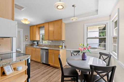 The kitchen offers a space for eating overlooking the yard