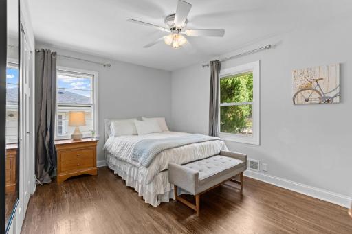 Primary bedroom with hardwood floors