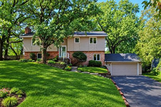 16015 Oakshore Drive Front Green Grass.jpg