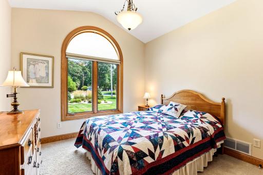 Main level ensuite bedroom with private 3/4 bath