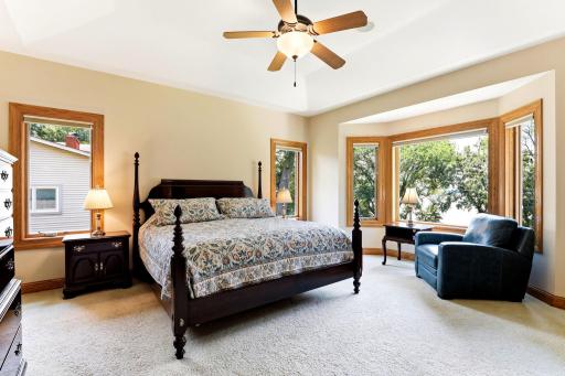 Main level owner's suite with tray ceiling & western lake views