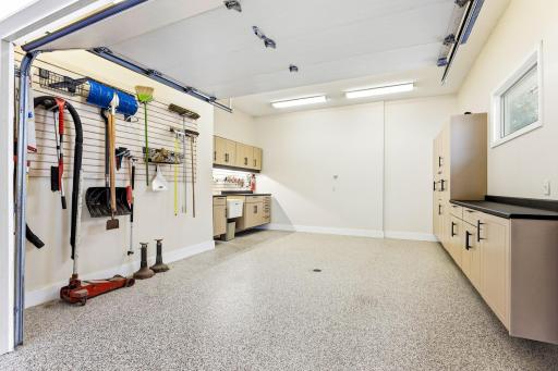 4th stall doubles as a heated workshop with interior garage door & floor drain