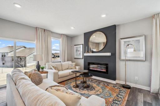 Large enough to accommodate just about any furniture set-up, the main level family room offers a great setting to relax in and flows seamlessly off both kitchen and dining areas!