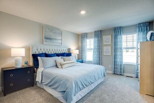 The homes primary bedroom is an oasis of its own! Complete with a private bath and walk-in closet, it's the perfect setting to start and end each day in! Model photo. Options and colors will vary.