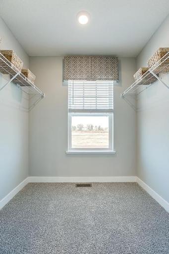 The homes primary bedroom is an oasis of its own! Complete with a private bath and walk-in closet, it's the perfect setting to start and end each day in! Model photo. Options and colors will vary.