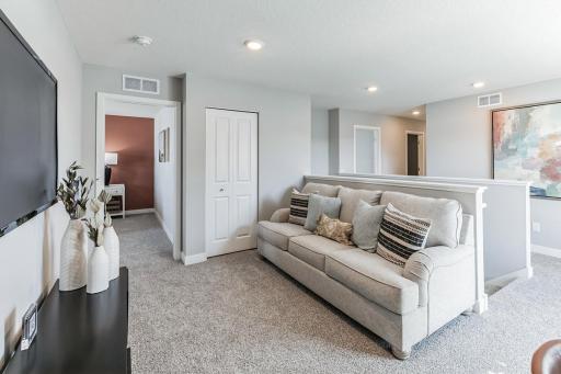 At the top of the staircase, you will find the home's loft area, with more than 100 square feet of additional living space, and just steps away from each of the home's four upper level bedrooms!