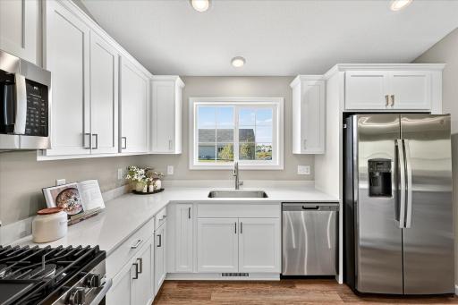 Kitchen - photo is of a previous inventory home. Inquire for more details and options.