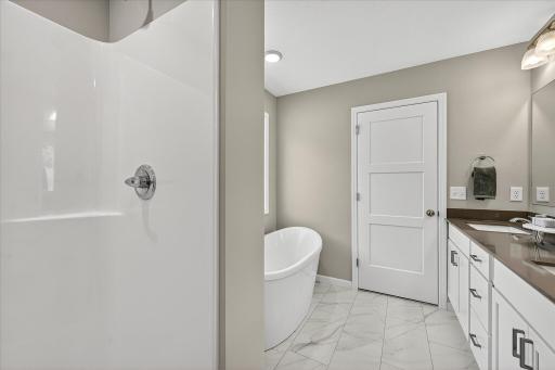 Primary Luxury Bath - photo is of a previous inventory home. Inquire for more details and options.