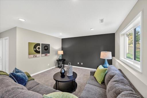 Finished Lower Level - photo is of a previous inventory home. Inquire for more details and options.