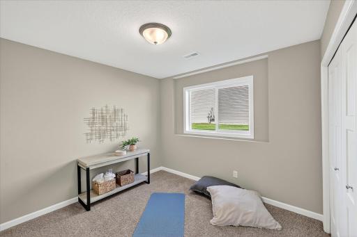 Lower Level Bedroom - photo is of a previous inventory home. Inquire for more details and options.