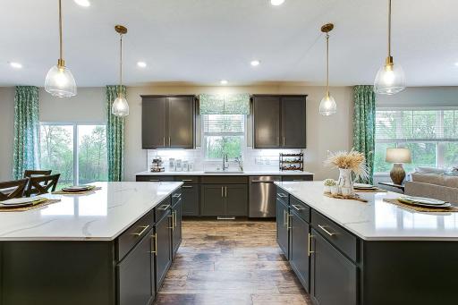 Sink is overlooking the backyard, no boring wall to look at here! *Photo of previously built model home. Finishes and selections to vary.