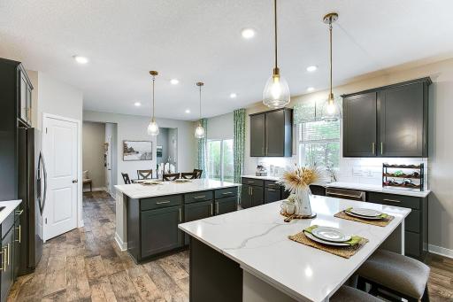 Just a lovely space, the perfect size for you to gather with loved ones. *Photo of previously built model home. Finishes and selections to vary.