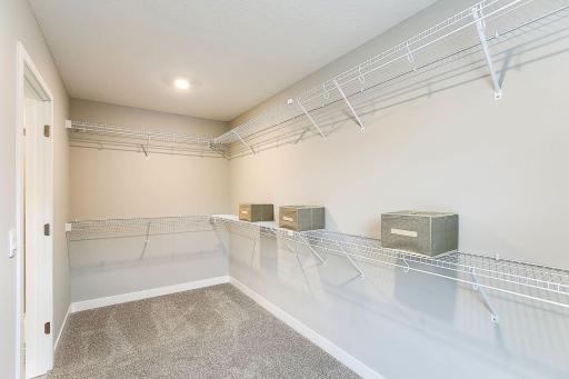 Enormous walk in closet, enough space, and then some! *Photo of previously built model home. Finishes and selections to vary.
