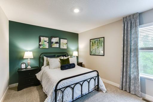 One of the three other bedrooms upstairs. This one is part of the Jack and Jill combination. *Photo of previously built model home. Finishes and selections to vary.