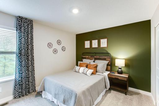 Bedroom 3 of the 3 other bedrooms upstairs. *Photo of previously built model home. Finishes and selections to vary.