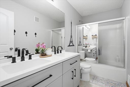 This upper level hall full bath has been modernized with a brand new double vanity!