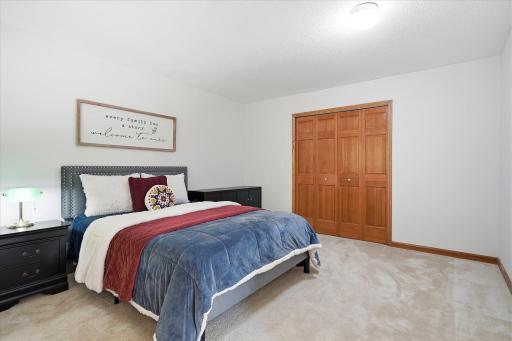 The closet has solid paneled doors.